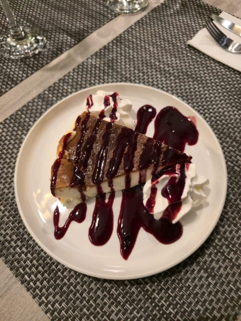 Basque burnt cheesecake with berry coulis and cream