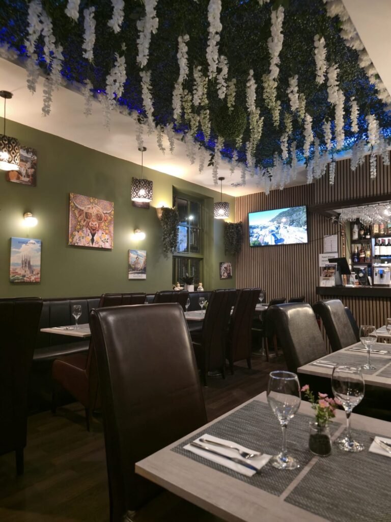 Dining room with hanging flower ceiling at Yannis & Daddy Liverpool
