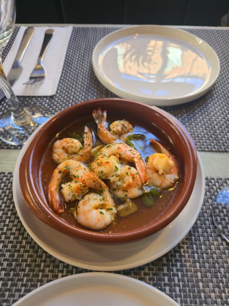 Garlic prawns gambas al ajillo in a clay dish