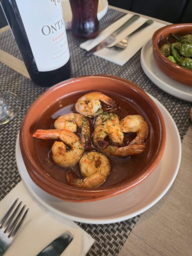 Gambas al ajillo garlic prawns served with Rioja wine