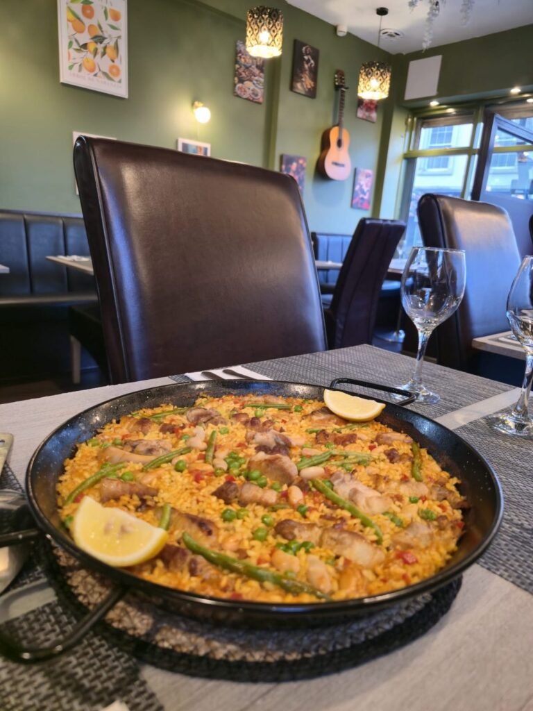 Traditional Spanish paella with prawns and lemon