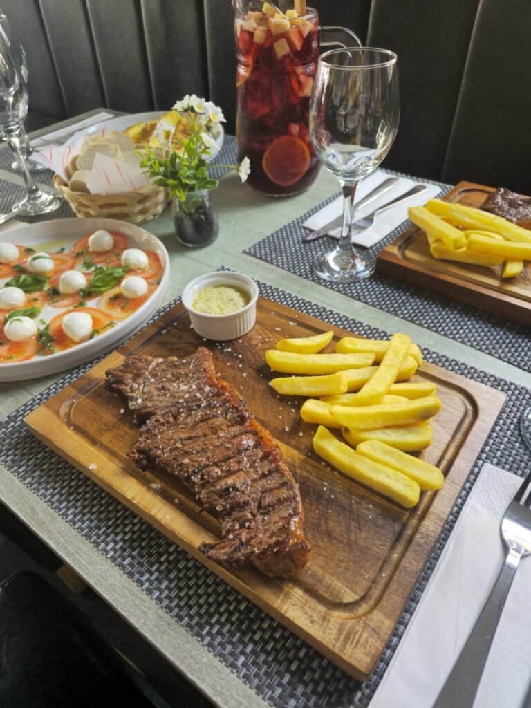 Steak with chips, caprese salad and homemade sangria